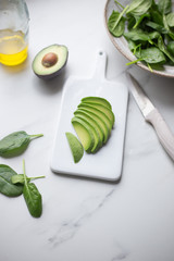 Obraz na płótnie Canvas vegetarian food salad, avocado, chickpeas, spinach, olive oil with snack