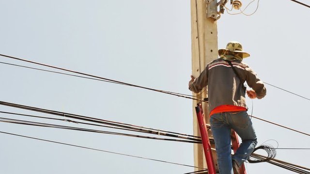 Technician connecting to the internet transmission line.