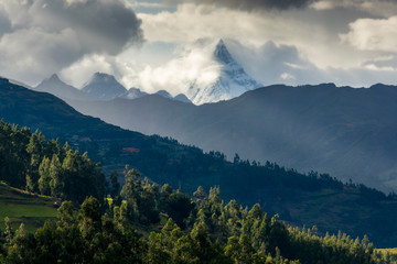 Panoramic view of Chacraraju peak from San Luis town at a cloudy day in Ancash Region, Peru