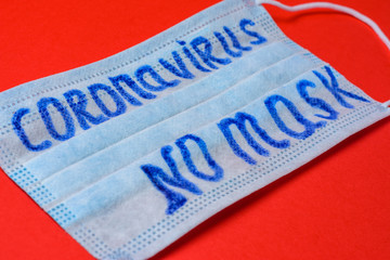 Obraz premium inscription coronavirus on mask, inscription no masks on red background.
