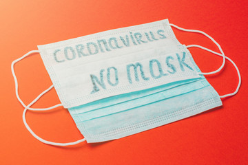 medical antiviral and antibacterial face mask with no masks, coronavirus on red background