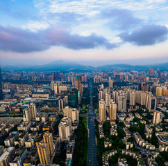 Fototapeta na wymiar A vertically-merged aerial panorama, showcasing the sunset cityscape and cars waiting for green light on the road in downtown, China.