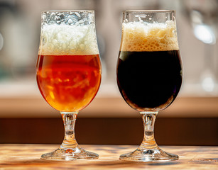 black and golden beer in glasses homemade brewing