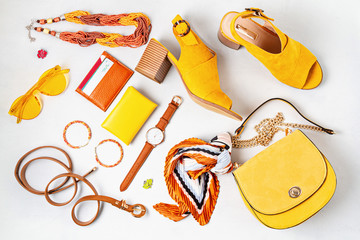 Fototapeta Flat lay with woman fashion accessories in yellow colors. Fashion, online beauty blog, summer style, shopping and trends idea obraz
