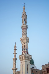 Fototapeta na wymiar Minarets of the mosque in the city