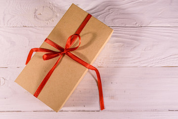 Cardboard gift box on a wooden table. Top view