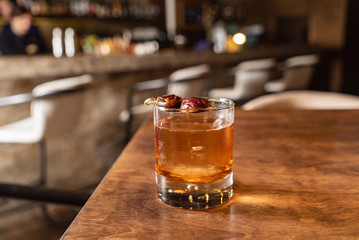 cocktail with olives on the table