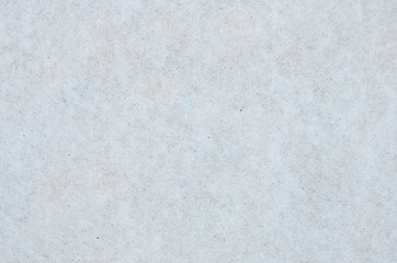 The texture of a soft paper napkin from recycled paper.