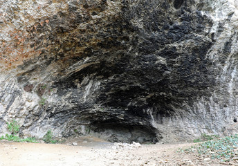cave in the rock used by primitive men as a shelter during the p