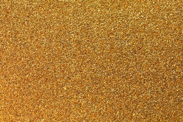 glittery background of golden glitter ideal  as a backdrop