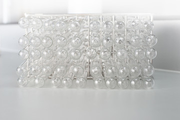 bottom of glass test tube in white gray medical health science laboratory