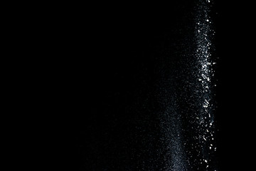 Fototapeta na wymiar Started splash of white flour powder on black background.