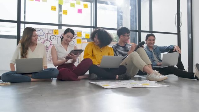 4k uhd Group of asian young creative happy people entrepreneur on a brainstorm business meeting Good leadership and teamwork workshop  lead to success office background