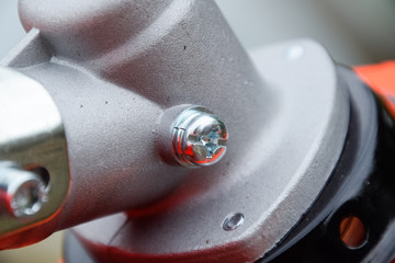 Fasteners for gas trimmer construction. Bolts and screws on the trimer body.