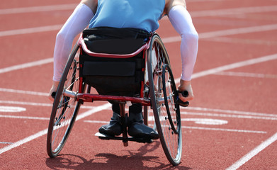 Paralympic athlete in a wheelchair with a paralysis in the legs
