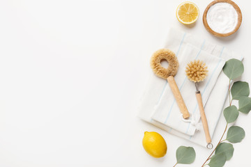 Composition with eco-friendly natural cleaners on white background