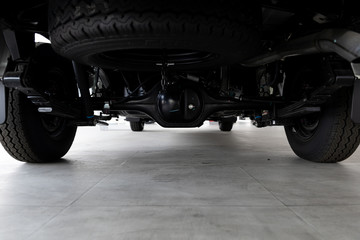 closeup suspension pickup truck soft-focus and over light in the background