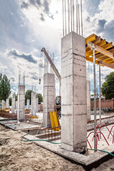 Concrete columns and construction crane