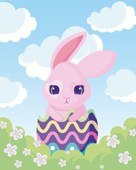 Obraz na płótnie Canvas cartoon rabbit in easter eggshell, colorful design