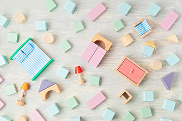 Flat lay with wooden  blocks in pastel colors. Eco friendly, zero waste, plastic free, educational, gender neutral toys for children