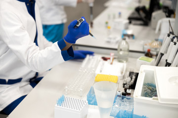 Male scientist doing biochemical blood test in laboratory