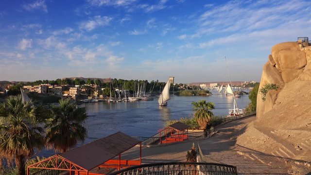 Beautiful landscape with felucca boats on Nile river in Aswan at sunset, Egypt, 4k