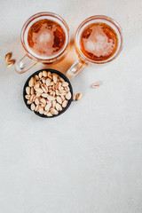 beer and snacks. bar table. restaurant, pub food. delicious craft lager and pistachios. party concept, brewery background