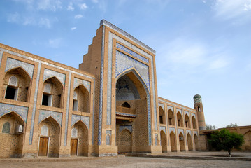 Fototapeta na wymiar Muhammad Rahim Khan II Madrasah (1871–1876, one of the biggest madrasahs of the city), Itchan Kala (old or inner town). Khiva town, Uzbekistan.