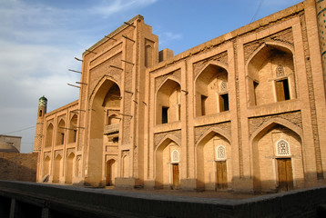 Obraz premium Facade (portal) of Amir Tura Madrasah (1870), Itchan Kala (old or inner town). Khiva town, Uzbekistan.