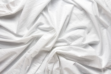 Obraz premium wrinkled white cotton sheet with large folds