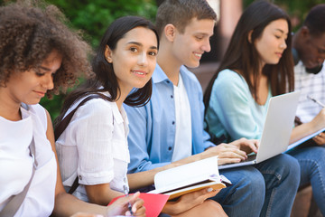 Exams Preparation. Group Of Multi-Ethnic Students Studying Together Outdoors