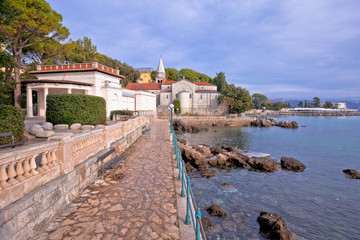 Adriatic town of Opatija watefront walkway and church view
