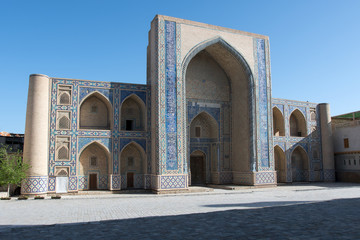 Fototapeta na wymiar Ulugbek Madrasah on the background of blue sky. Bukhara, Uzbekistan, Central Asia.