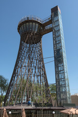 Shukhov Tower (as well Bukhara tower, 1929) with tourists on it. Bukhara, Uzbekistan.