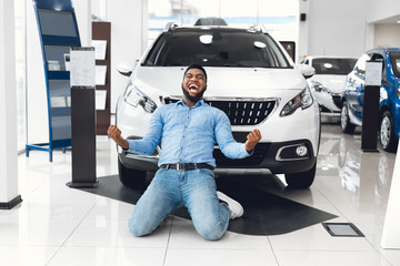 Excited Man Shouting Shaking Fists Buying New Car In Dealership