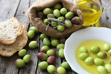 Olive sack, olive oil bottle and bread
