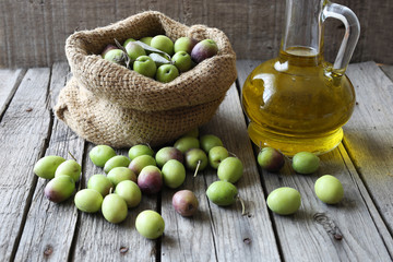 Olive sack and olive oil bottle