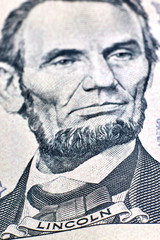 five dollars. The inscription Lincoln in focus. Portrait no focus. Close-up. Macro