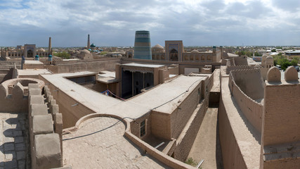 Panorama of Itchan Kala (old or inner city), view at Kuhna Ark palace (fortress) and Kalta-minor Minaret. Khiva, Uzbekistan, Central Asia.