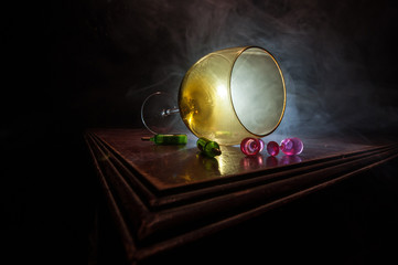 Goblet of white wine on wooden table on wooden wall background
