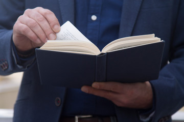 man reading a book close up view