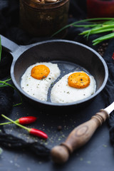 Table top scene with raw vegan eggs made of coconut butter and cashew with chilli pepper. Raw food for vegan menu.