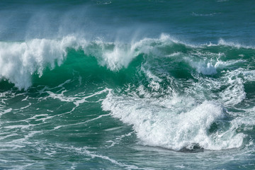 Fototapeta na wymiar Swirling Surf at Fistral Beach