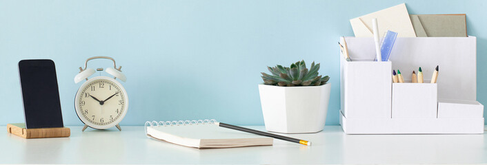 School desktop in modern style with Blank space. Modern home interior design on blue panoramic background.