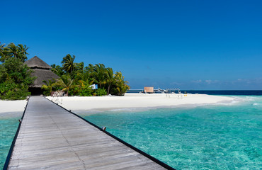 Fototapeta na wymiar Maldives, Kaafu atoll - December 27 2019 - A wooden pier to heaven
