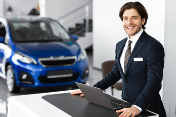 Car Seller Standing In Luxury Dealership Office