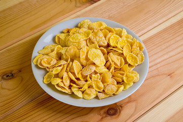 Glazed cornflakes. Breakfast cereals. Background for healthy eating and vegetarianism.