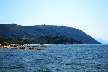 Fototapeta premium Ouranopolis coast. Landscape of a beach in ancient town Uranopolis near Mount Athos, Halkidiki, Greece.