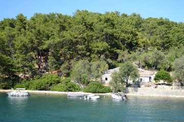 Nisida Agios Nikolaos in front of Paxos island and the canal between them.
