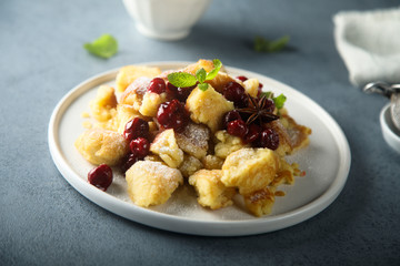 Homemade traditional Austrian pancake with cherry sauce